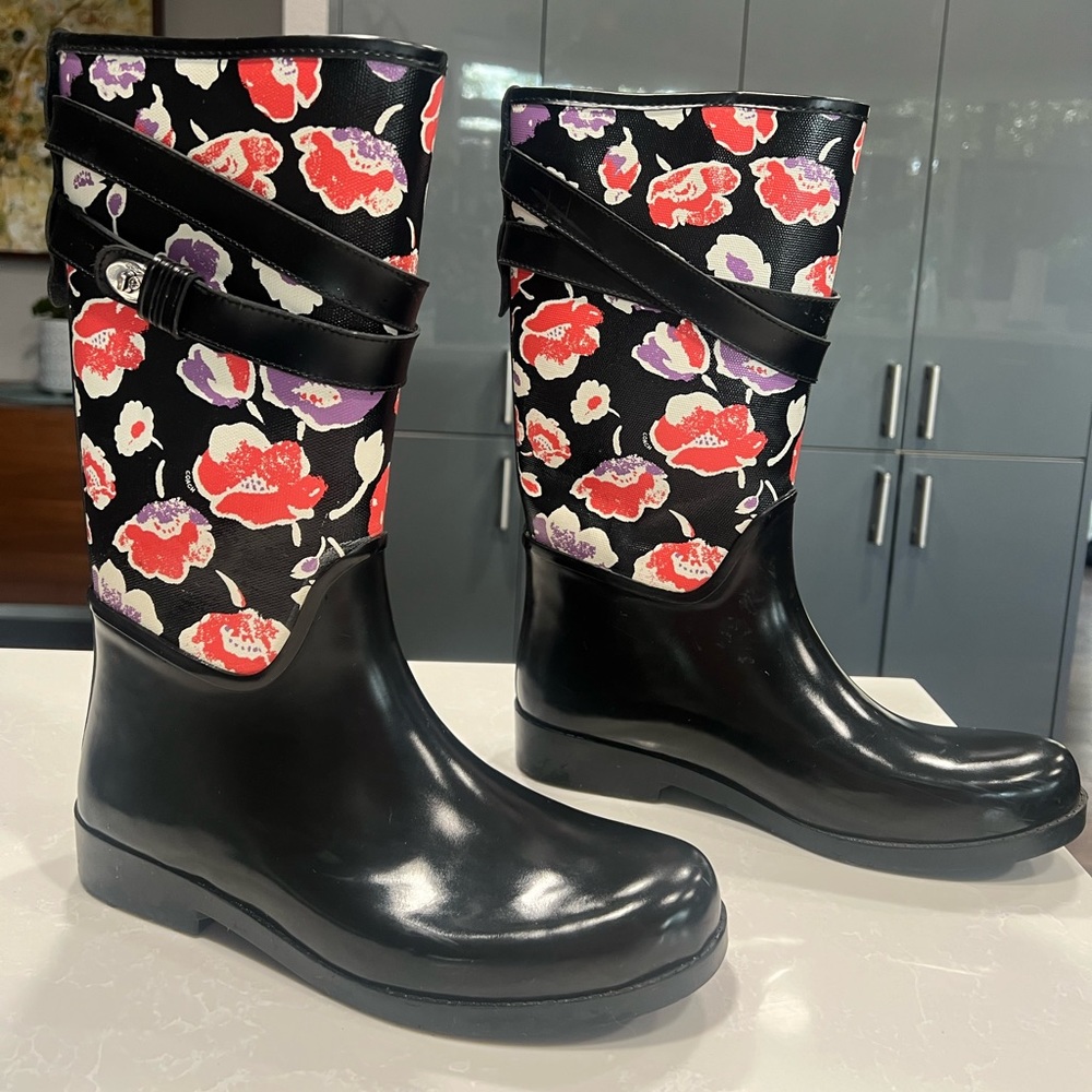 Coach black and floral rain boots.